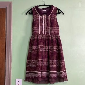 Axes Femme: Red, music note dress with rose button details. Size Small